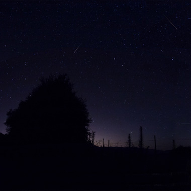 Panorama of night sky during meteor shower