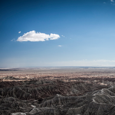 Overlooking mountains and a deep blue sky in the desert
