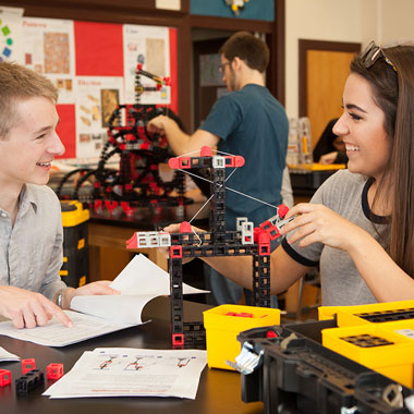 2 students building with a Rokenbok SnapStack Module